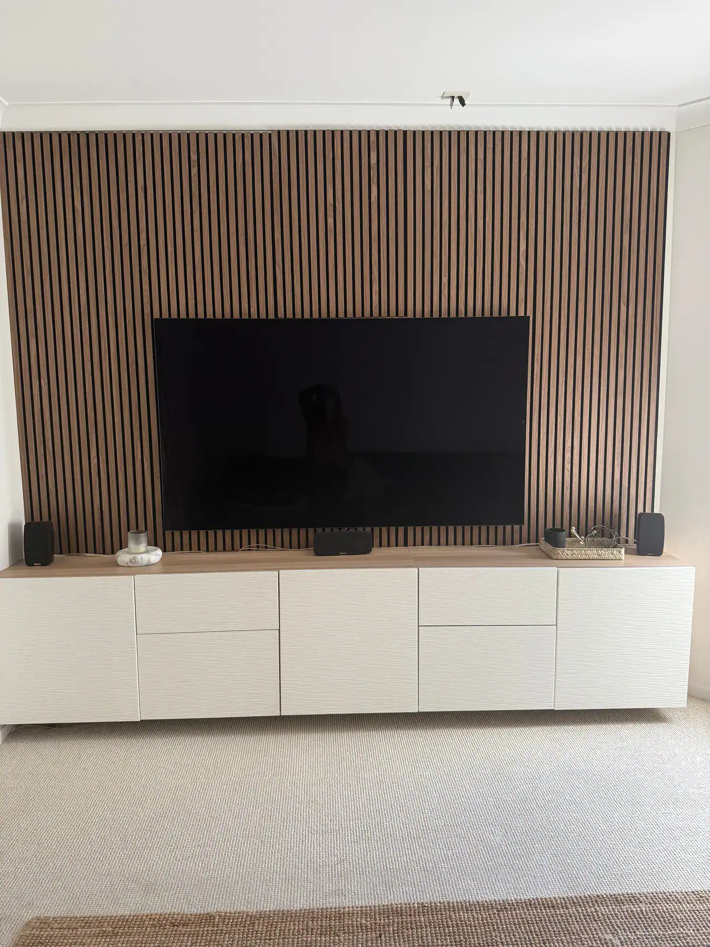 stylish media room with walnut acoustic wall panels